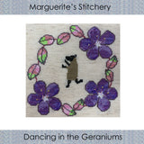 a cross stitch design featuring a dancing sheep in a wreath of purple flowers