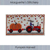 cross stitch design featuring a farmer rabbit on a red tractor hauling a giant orange pumpkin