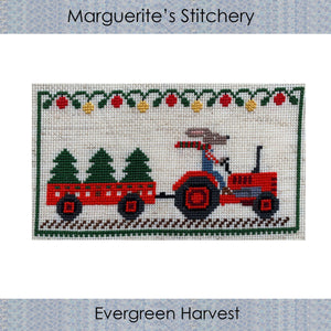 cross stitch design featuring a rabbit farmer on a red tractor with a cart of evergreen trees