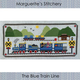 cross stitch design featuring a blue train with rabbit figures with a range of green mountains in the background