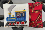 a sample finishing method for part of The Blue Train Line cross stitch chart - a small pillow with just the engine